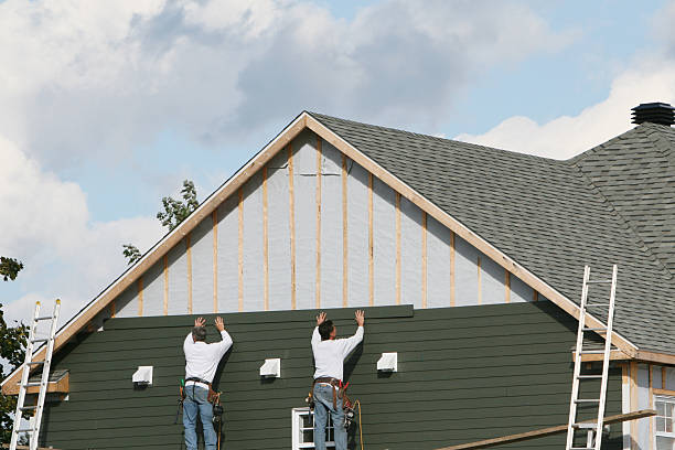 Professional Siding technician working in Drayden, MD